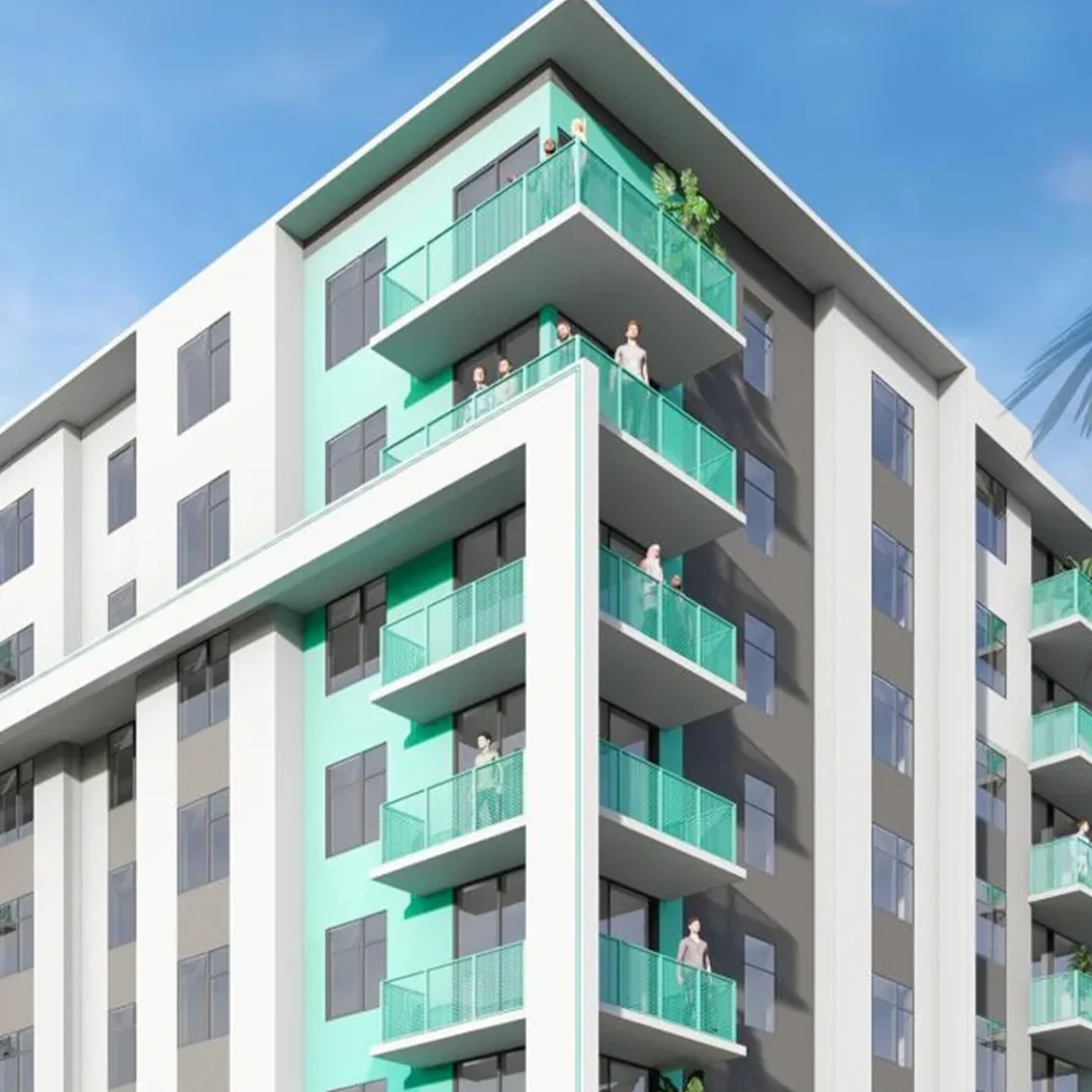 Apartment building exterior with multiple balconies and large windows.