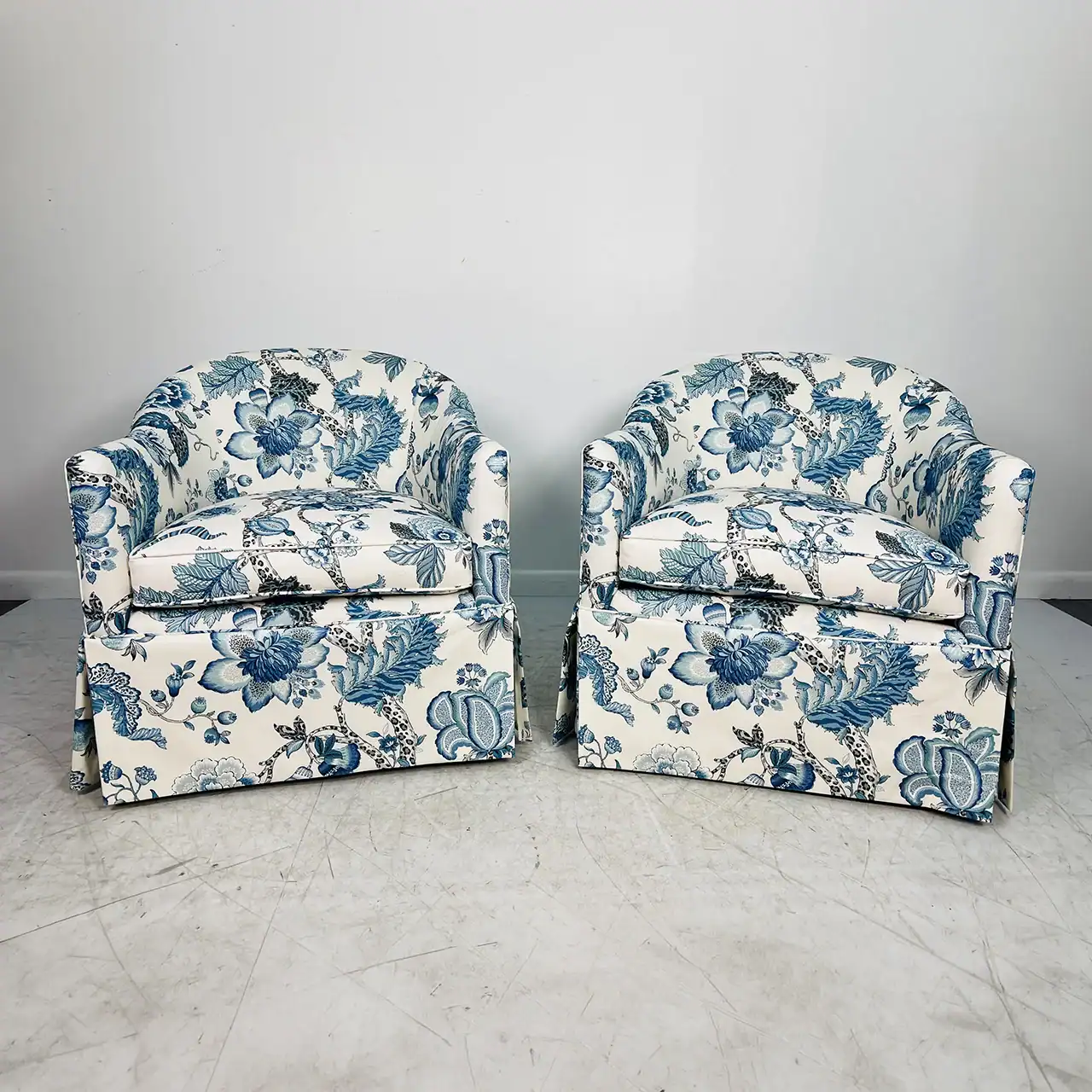 Armchairs with blue floral pattern upholstery.